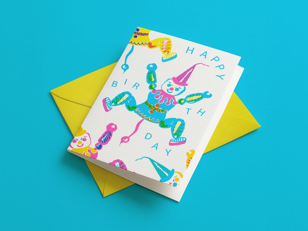 Colorful birthday card with clown design on a blue background