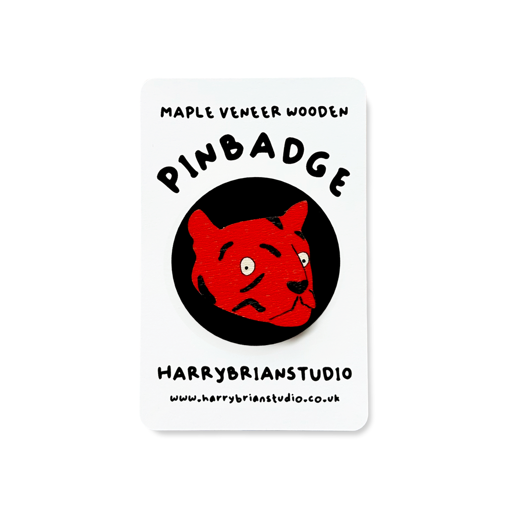 Maple veneer wood pinbadge with a bright, orange tiger face, cut out.